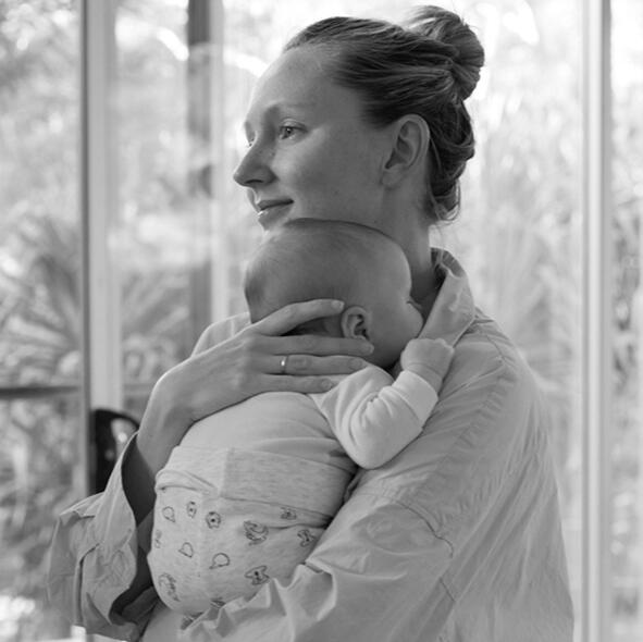 mother-cuddling-newborn-warm-embrace-supported-postnatal-joy-image